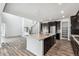 Spacious kitchen with center island and stainless appliances leading into the open floorplan at 2548 Lupton Ln, Lafayette, CO 80026