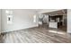 Bright, open-concept living room featuring hardwood floors and seamless transition to the modern kitchen at 2548 Lupton Ln, Lafayette, CO 80026