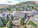 Beautiful home featuring professional landscaping and lush green grass with a view of the neighborhood at 1034 Halfmoon Dr, Castle Rock, CO 80104