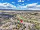 A high-angle shot shows the home's location in a neighborhood near mountain views at 1034 Halfmoon Dr, Castle Rock, CO 80104
