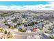 An aerial view shows a home on a corner lot in a well-maintained residential area at 1034 Halfmoon Dr, Castle Rock, CO 80104