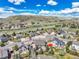An aerial shot showcases a house with a neat backyard in a suburban neighborhood at 1034 Halfmoon Dr, Castle Rock, CO 80104