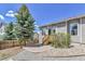 Backyard with stone patio provides a relaxing outdoor space at 1034 Halfmoon Dr, Castle Rock, CO 80104