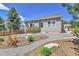 Well maintained backyard with stone patio and attractive landscaping at 1034 Halfmoon Dr, Castle Rock, CO 80104