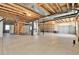 Unfinished basement offers ample space and exposed ceiling for storage at 1034 Halfmoon Dr, Castle Rock, CO 80104