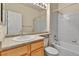 Standard bathroom with tiled shower/tub, large mirror, and spacious vanity area at 1034 Halfmoon Dr, Castle Rock, CO 80104