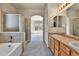 This bathroom has a dual sink vanity, soaking tub and glass shower at 1034 Halfmoon Dr, Castle Rock, CO 80104