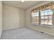Bright bedroom with neutral walls, large windows, and plush carpeting at 1034 Halfmoon Dr, Castle Rock, CO 80104