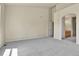 Large bedroom with high ceilings, plush carpet, and archway leading to the en-suite bathroom at 1034 Halfmoon Dr, Castle Rock, CO 80104