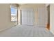 Cozy bedroom features closet, neutral walls, and plush carpeting at 1034 Halfmoon Dr, Castle Rock, CO 80104