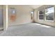 Spacious bedroom with plush carpet and plenty of natural light from large windows at 1034 Halfmoon Dr, Castle Rock, CO 80104
