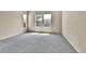 Spacious bedroom featuring neutral carpet and natural light from multiple windows at 1034 Halfmoon Dr, Castle Rock, CO 80104