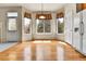 Charming dining area boasts hardwood floors and a bay window, creating a warm atmosphere at 1034 Halfmoon Dr, Castle Rock, CO 80104