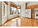 Bright kitchen featuring a bay window, wood cabinets, and modern white appliances at 1034 Halfmoon Dr, Castle Rock, CO 80104