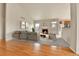 Living room with comfortable sofa, fireplace, and views into the kitchen at 1034 Halfmoon Dr, Castle Rock, CO 80104