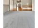 Carpeted living room with hardwood floors in the foyer at 1034 Halfmoon Dr, Castle Rock, CO 80104
