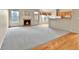 This open-concept living room is bright and open, featuring hardwood floors, and a beautiful fireplace at 1034 Halfmoon Dr, Castle Rock, CO 80104