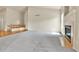 Living room with fireplace, carpeted floors, and a staircase at 1034 Halfmoon Dr, Castle Rock, CO 80104