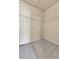 Spacious walk-in closet features wire shelving and neutral carpeting at 1034 Halfmoon Dr, Castle Rock, CO 80104