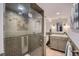 Modern bathroom featuring a glass-enclosed shower with designer tile and a stylish vanity at 108 W Byers Pl # 106, Denver, CO 80223