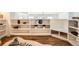 Modern bedroom with hardwood floors, white shelving, and Zebra rug accents at 108 W Byers Pl # 106, Denver, CO 80223