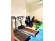 An open gym featuring treadmill, stationary bike, weight bench and exercise ball for a great workout at 108 W Byers Pl # 106, Denver, CO 80223