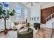 Bright living room with large windows, exposed brick, and hardwood floors create a welcoming space at 108 W Byers Pl # 106, Denver, CO 80223