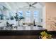 Bright living room featuring large windows, ceiling fan, and contemporary decor at 108 W Byers Pl # 106, Denver, CO 80223
