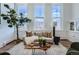 Sun-filled living room with stylish decor offers a perfect blend of comfort and contemporary design at 108 W Byers Pl # 106, Denver, CO 80223
