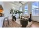 This living room offers stylish seating and bright airy windows, creating a peaceful and inviting space at 108 W Byers Pl # 106, Denver, CO 80223