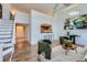 Living room has a modern design with unique furniture, opening to another space with a staircase at 108 W Byers Pl # 106, Denver, CO 80223