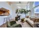 Bright living room with modern decor, seamlessly integrating the open kitchen bar for easy entertaining at 108 W Byers Pl # 106, Denver, CO 80223