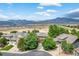 Suburban aerial view features mountain views, a cul-de-sac, and neighborhood construction at 14682 W Amherst Pl, Lakewood, CO 80228