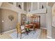 Formal dining room featuring elegant chandelier, hutch, and stylish decor at 14682 W Amherst Pl, Lakewood, CO 80228