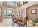 Dining area with chandelier and large windows at 14682 W Amherst Pl, Lakewood, CO 80228