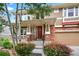 Eye-level angle of home featuring brick accents, siding, and a cozy porch with curb appeal at 14682 W Amherst Pl, Lakewood, CO 80228