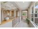 Upstairs hallway with detailed ceiling, archways, and large windows, offering a bright and airy feel at 14682 W Amherst Pl, Lakewood, CO 80228