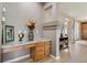 Hallway featuring a built-in desk with granite countertop and decorative flower arrangements, perfect for a stylish workspace at 14682 W Amherst Pl, Lakewood, CO 80228