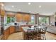 Modern kitchen with stainless steel appliances, granite countertops, and a central island at 14682 W Amherst Pl, Lakewood, CO 80228