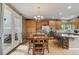 Bright eat-in kitchen with access to the deck and stainless steel appliances at 14682 W Amherst Pl, Lakewood, CO 80228