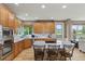 Bright, open kitchen with stainless steel appliances, granite countertops, and a central island at 14682 W Amherst Pl, Lakewood, CO 80228