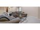 Finished basement offers a living room with a large sectional sofa and a coffee table at 14682 W Amherst Pl, Lakewood, CO 80228