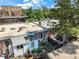 This aerial view highlights a private backyard with lush greenery, enclosed by a wooden fence, creating a serene outdoor space at 22 E Bayaud Ave, Denver, CO 80209