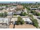 This aerial view shows the charming neighborhood with tree-lined streets and proximity to Denver's skyline at 22 E Bayaud Ave, Denver, CO 80209