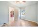 This bedroom has hardwood floors, natural light, baseboard trim, ceiling fan and open doorway at 22 E Bayaud Ave, Denver, CO 80209