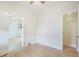 This bedroom has hardwood floors, baseboard trim, an open doorway and ceiling fan at 22 E Bayaud Ave, Denver, CO 80209