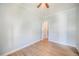 This bedroom features light blue walls, an open doorway, hardwood floors and a ceiling fan at 22 E Bayaud Ave, Denver, CO 80209