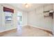 Cozy bedroom with hardwood floors, a window with an air conditioner, and a unique wall shelf design at 22 E Bayaud Ave, Denver, CO 80209