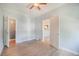 This bedroom has hardwood floors, baseboard trim, ceiling fan and two open doorways at 22 E Bayaud Ave, Denver, CO 80209