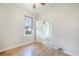 This bedroom features hardwood floors, baseboard trim, natural light, ceiling fan and an open door at 22 E Bayaud Ave, Denver, CO 80209